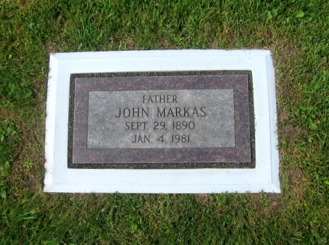 A foot marker set inside a Grave Saver foundation, level and framed at ground level.