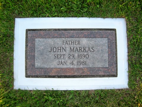 The Markas family marker after Grave Saver: framed, level, and clean-edged.